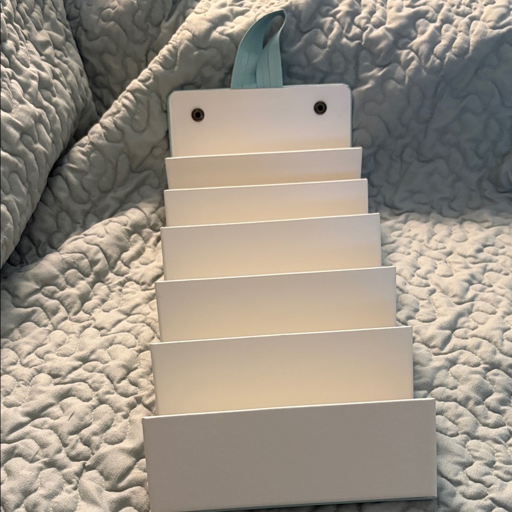 Six compartment roll up glass case.